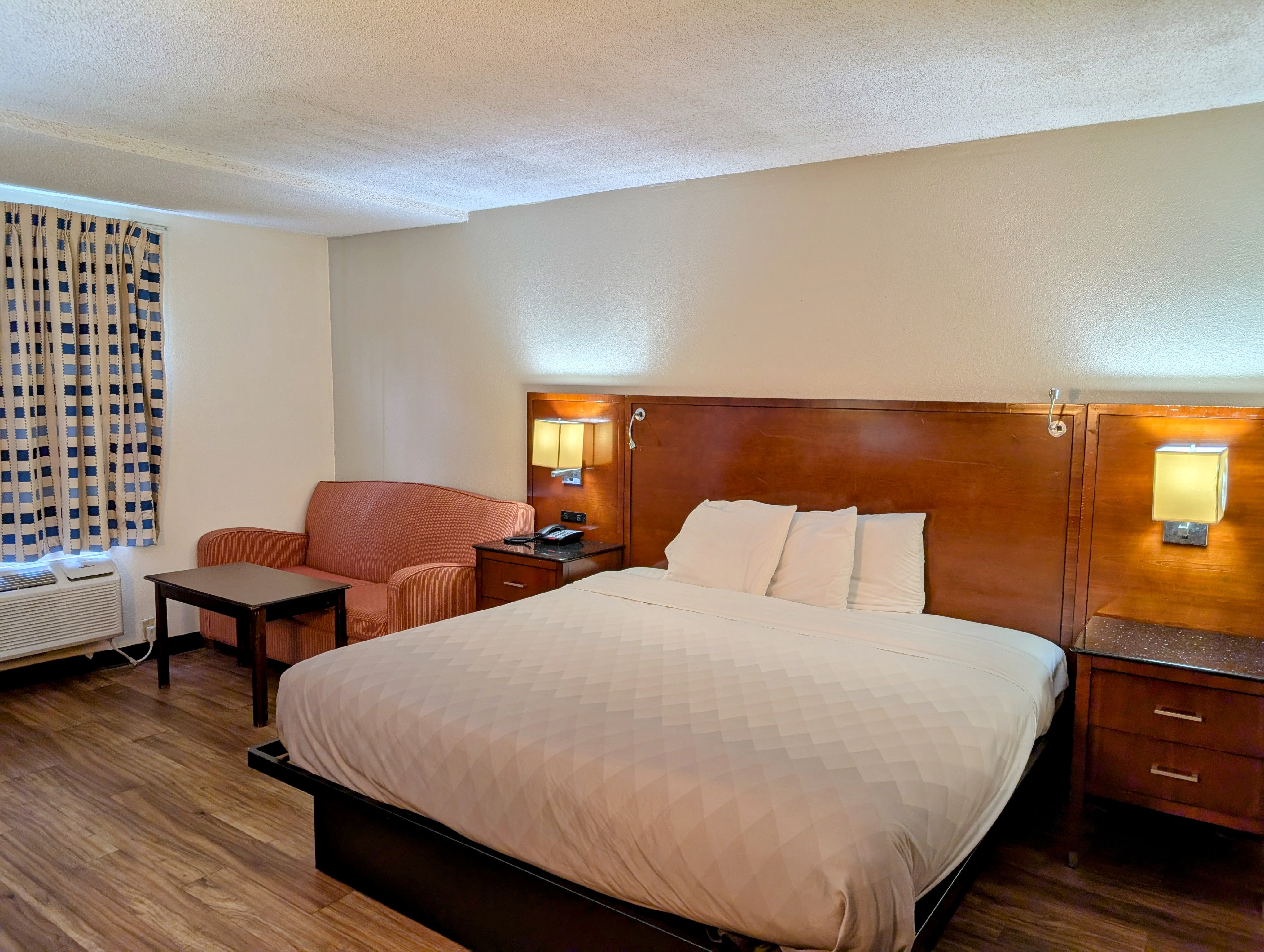 Forsythia Inn King Guest Room showing premium mattress bedding and workspace